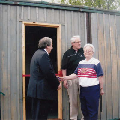 Photograph- Cutting the Ribbon of the Boxcar House