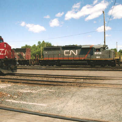 Photograph - CN locomotive no. 6910 in railroad yard