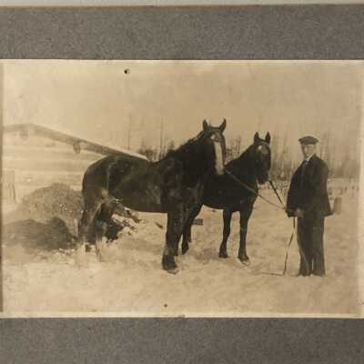 Photograph of man with two horses glued to cardboard frame