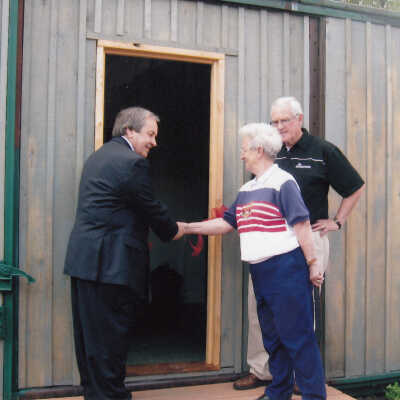 Photograph- Ribbon Cut on the Boxcar House