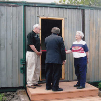 Photograph- Examining the Boxcar House
