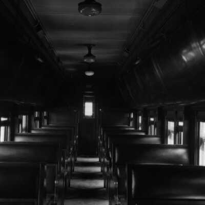 Photograph, Canadian National Railways (CNR) car - inside luggage compartment above passenger seat.