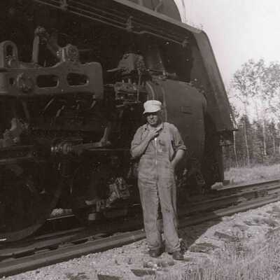 Photograph, Engineer in front of 6077.