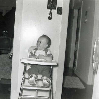 Photograph - Patrick Sweezey in a high chair