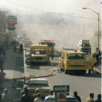 Photograph, Fire Department Responding to Capreol Hotel Fire, Riviera Hotel Depicted.