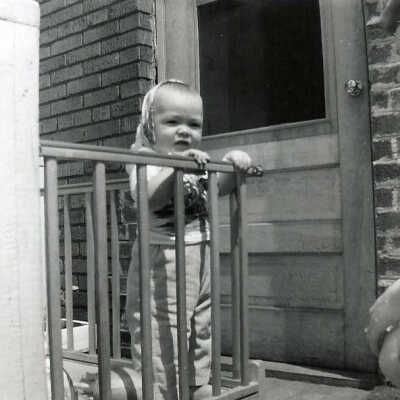 Photograph - Patrick Sweezey on the landing outside the back door