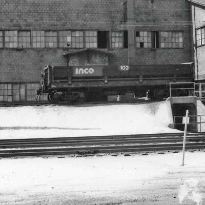 Photograph - INCO railroad car no. 103 outside brick building