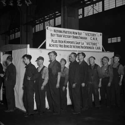 Photograph, Canadian National Railways (CNR) employees buy Victory Bonds through Canadian National Railways (CNR).
