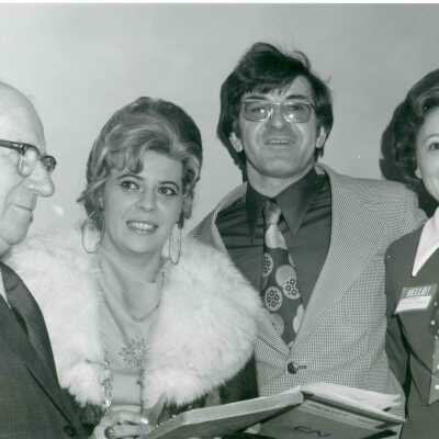 Photograph, Mayor Prescott collects registration signatures from former students Mr and Mrs R Mazzuca, centre, and Mrs Sphiuk.