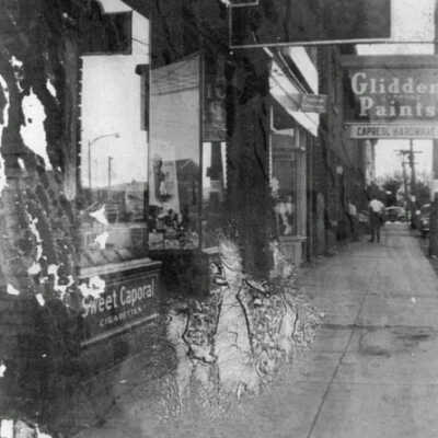 Photograph, I.R. Douglas Drug Store and Capreol Hardware, Young Street, Capreol, Ontario.