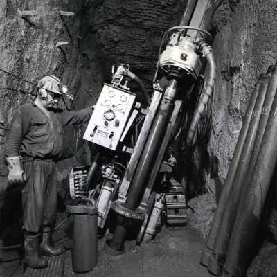 Photograph, In The Hole (ITH) Machine drilling 6.5 inch Blast Holes.