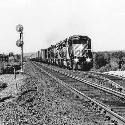 Photograph - August 1981 EB freight train approaching Azilda, ON