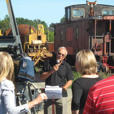 Photograph, NORMHC, Director Bob Michelutti speaks during grand opening of mining exhibit.