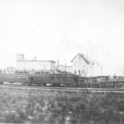 Photograph of a Passenger Train Passing through Depot Harbour
