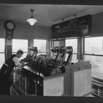 Photograph, Interior of Canadian Pacific Railways switch control station at Glen Yard.