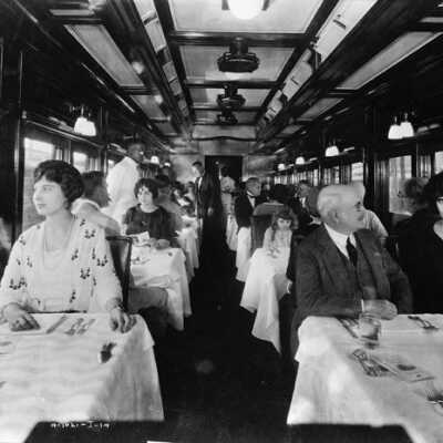 Photograph, Interior of dining car, Canadian Northern Railway.
