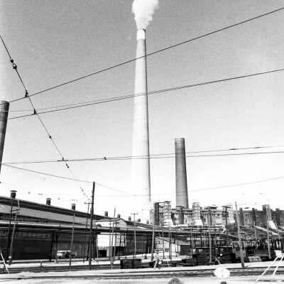 Photograph - Smoke stack and refinery (?)
