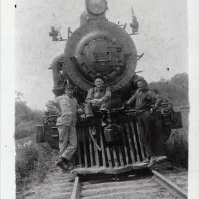 Photograph - Three men posing on steam locomotive no. 550