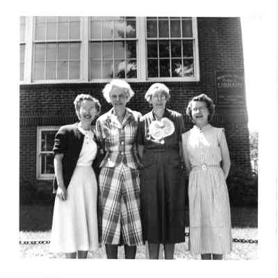 Staff in front of Basement Library