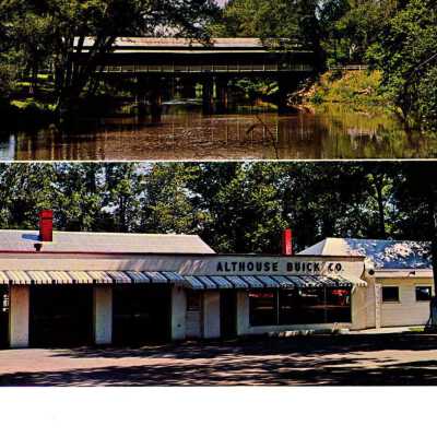 Postcard of Althouse Buick Company next to Covered Bridge