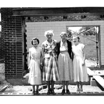 Library Staff in front of new library construction