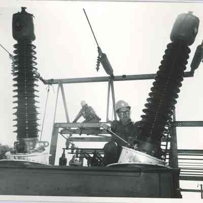 Workers install new transformer