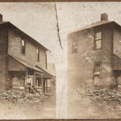 House with three people on porch