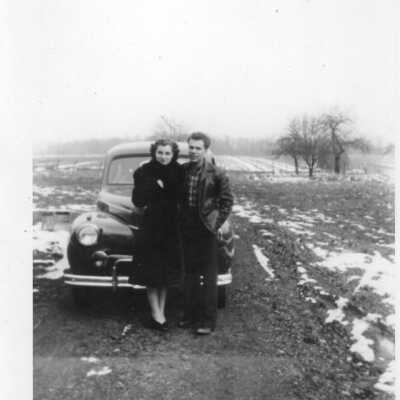 Couple in front of car