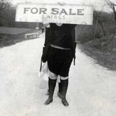 Woman with For Sale Sign