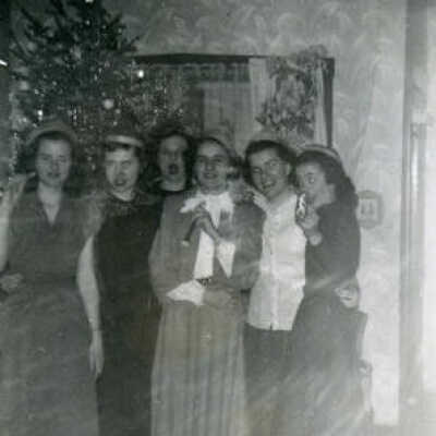 Young women with Christmas tree