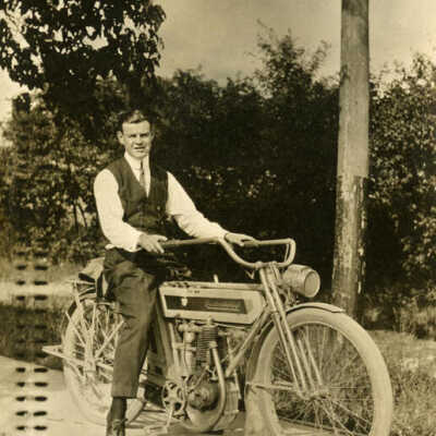 Walter Kidder on motorcycle