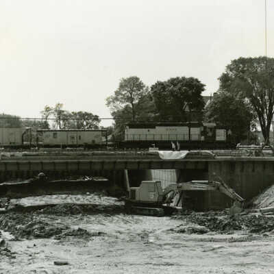 Freight Train Traveling Over Underpass Construction