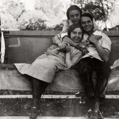 Three People on Swing Bench