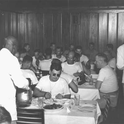 During World War II, the Grand Hotel was converted into a military training facility, known as Operation Ivory Soap. Lt. Col. Matthew Thompson is seated in the Grand Dining Room (the mess hall) in 1944.