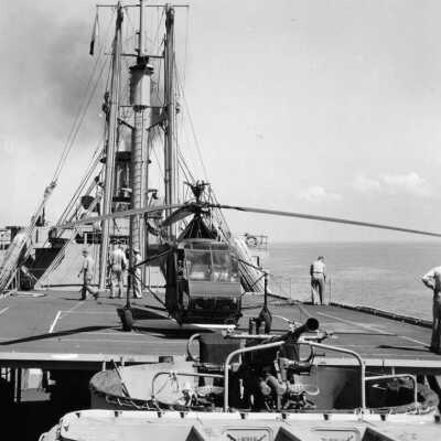 WWII Operation Ivory Soap - Sikorsky helicopter on deck of ARU, Floating