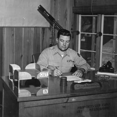 Lt. Col. Matthew Thompson was the commander of Operation Ivory Soap in 1944-1945. He is seated at his desk in the East Wing of Grand Hotel, now known as the Thompson Suite. Circa July 1944