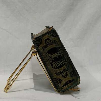 FIC 2015.95 spine: Copyright: The Sutliff Museum; Origsize: 6 x 4.5 x 3.25"; Origformat: Artifact; Resolution: 72 dpi