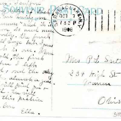 A vintage postcard with handwritten text and a green one-cent stamp.