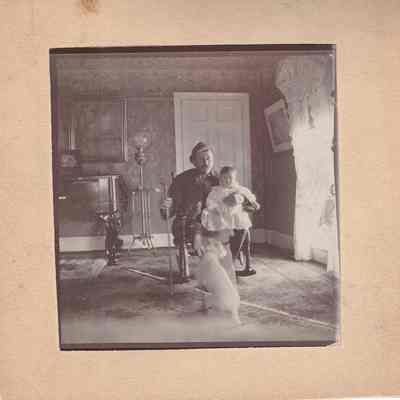 Plumb W. Sutliff holding Edward Sutliff Brainard