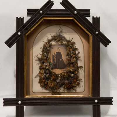 Eastlake style wooden frame with photograph of Mary Sutliff