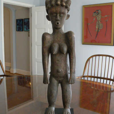 Mother with Child Clinging to her Back.