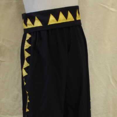 Black pants with yellow triangles down each side of leg and matching belt