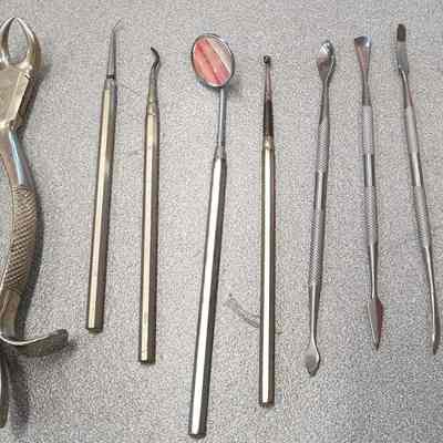 Collection of metal tools, pliers and tweezers