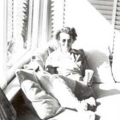 Woman Reclining in Window Seat