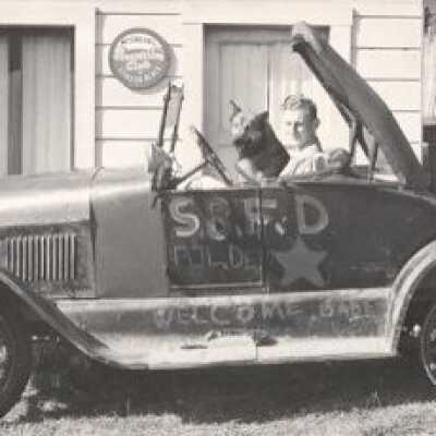 Robert Airey in car with dog
