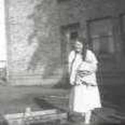 Woman outside house