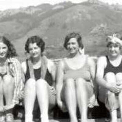 Four girls sitting in a row