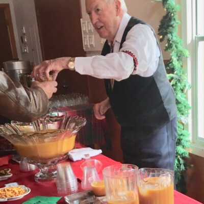 Al Engel Serves His Christmas Punch