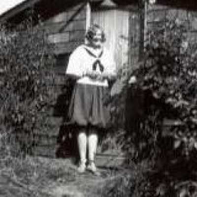 Woman in Front of House