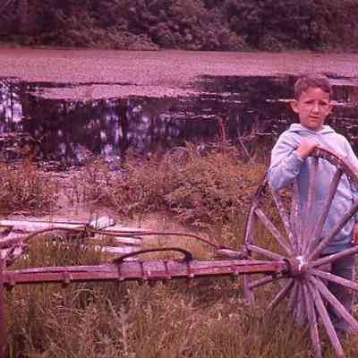 32. KJH and wagon wheels and axle: Eagle Pond, Ebey's Landing - ca. 1960